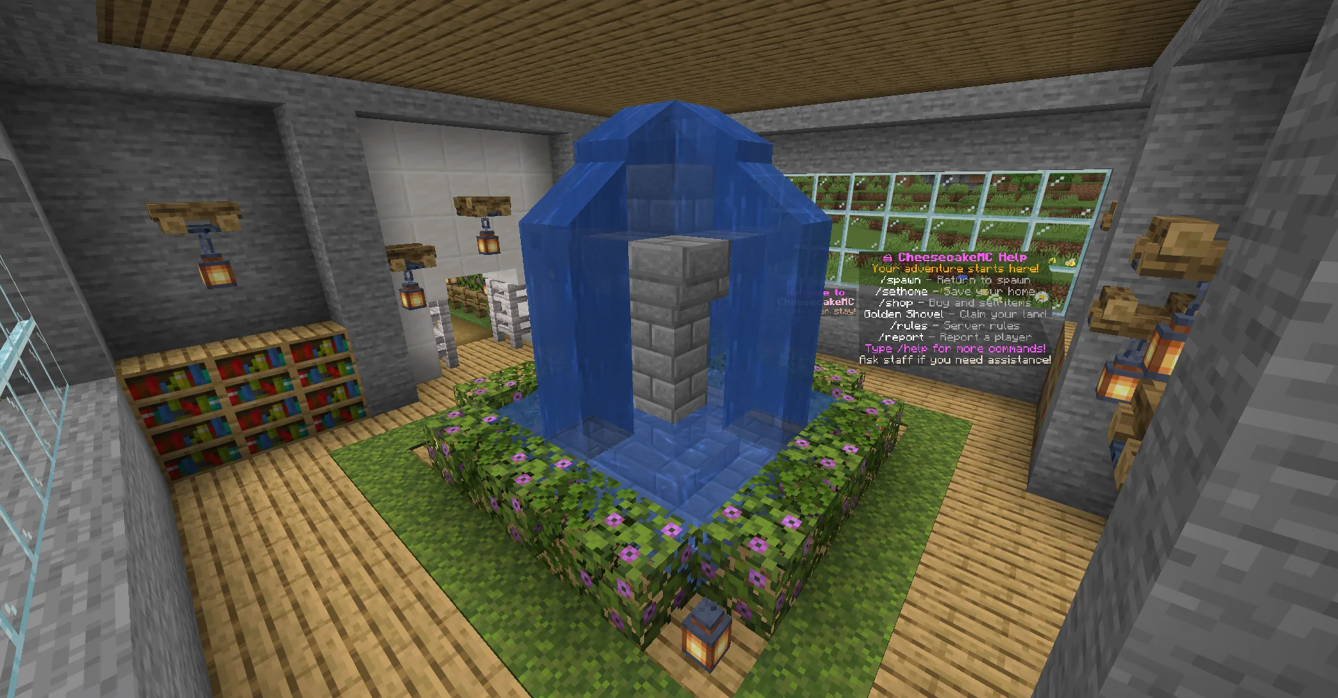Indoor fountain surrounded by flowering hedges and lanterns in CheesecakeMC's lobby